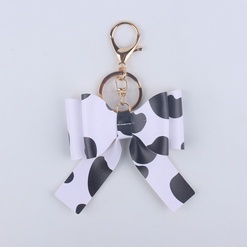 Wholesale Cartoon Aztec Color Bow Leather Keychain