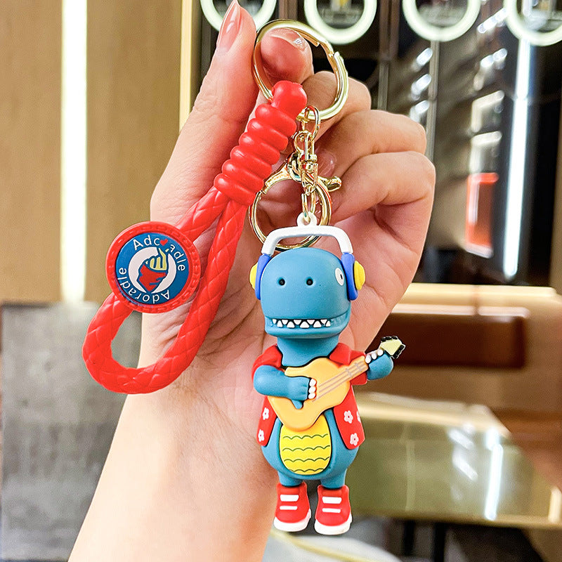 Wholesale New Creative Music Skateboard Dinosaur Doll Pvc Keychain