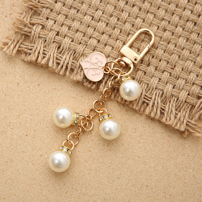 Keychanes de aleación de corazón de perla cristalina al por mayor