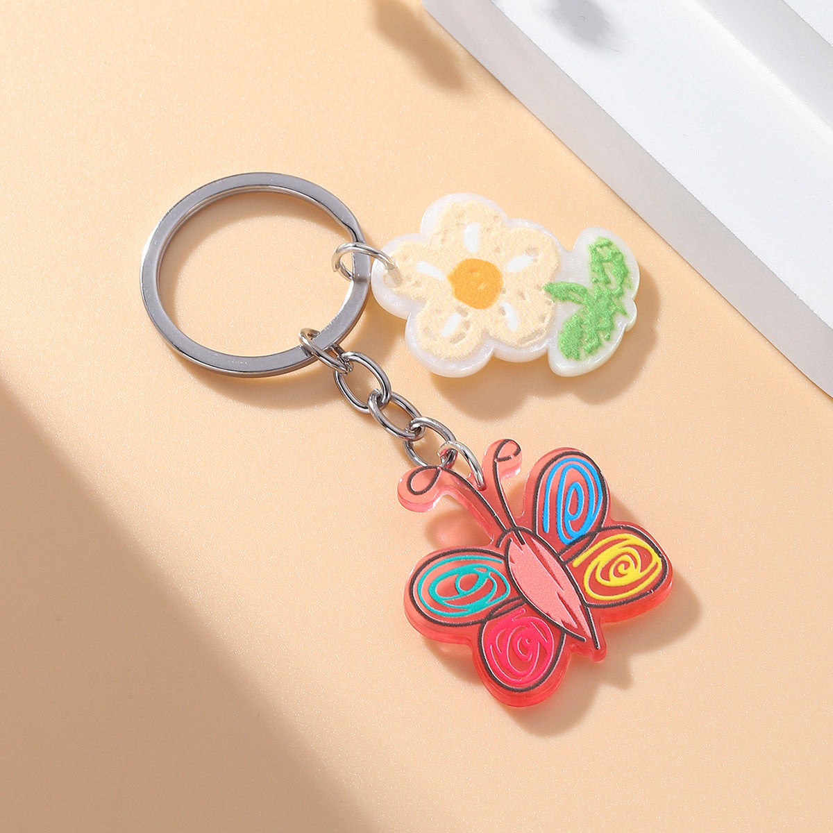 Llavero de mariposa de flores acrílicas al por mayor