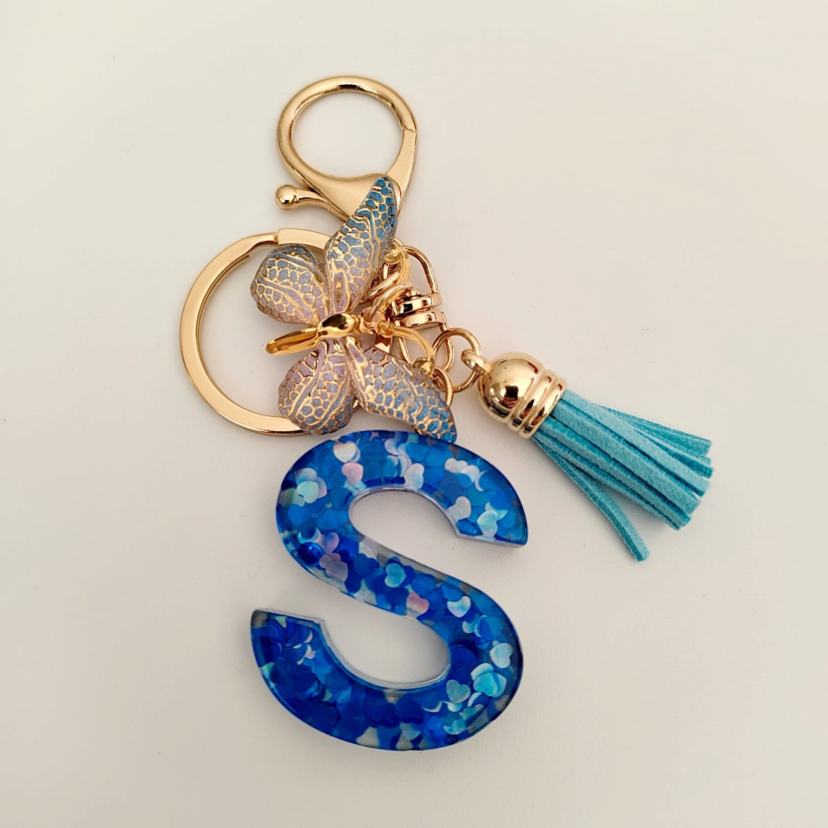 Wholesale blue crystal epoxy letter key chain pendant resin sequined butterfly key chain
