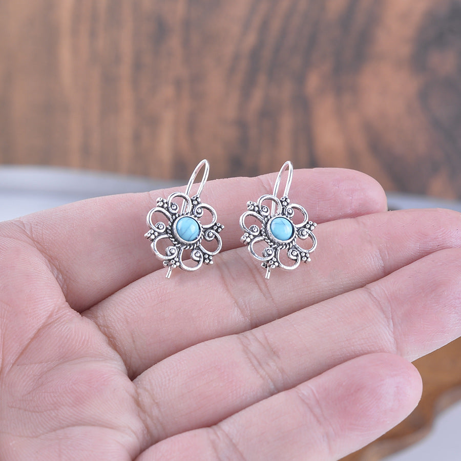 Wholesale Hollow petal inlaid turquoise drop earrings