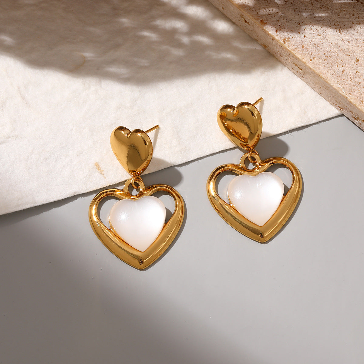 Wholesale Stainless steel heart earrings for women inlaid with cat' s eye stone