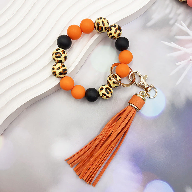 Wholesale Leopard Print Wood Beads Silicone Beaded Bracelet Tassel Key Ring