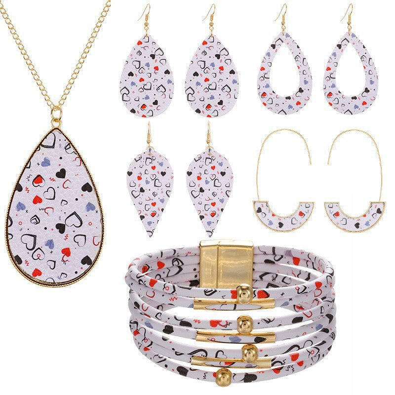 Conjunto de brazalete de arete de cuero de la serie de amor rosa al por mayor