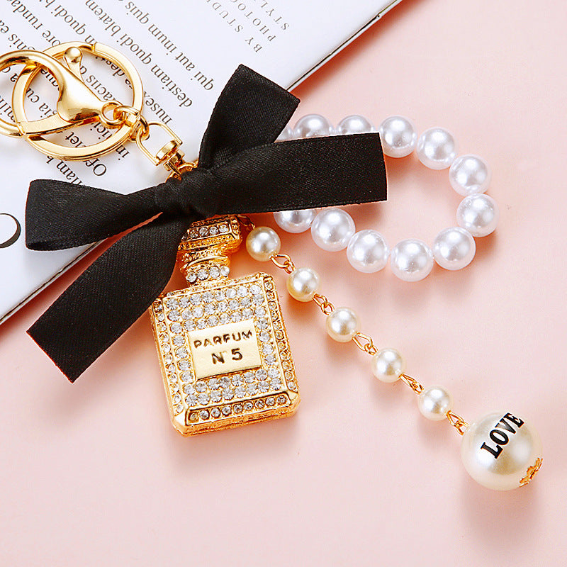 Wholesale Pearl Perfume Bottle Bow Rhinestone Keychain Bag Charm Chic Fashion Accessory Boutique Gift