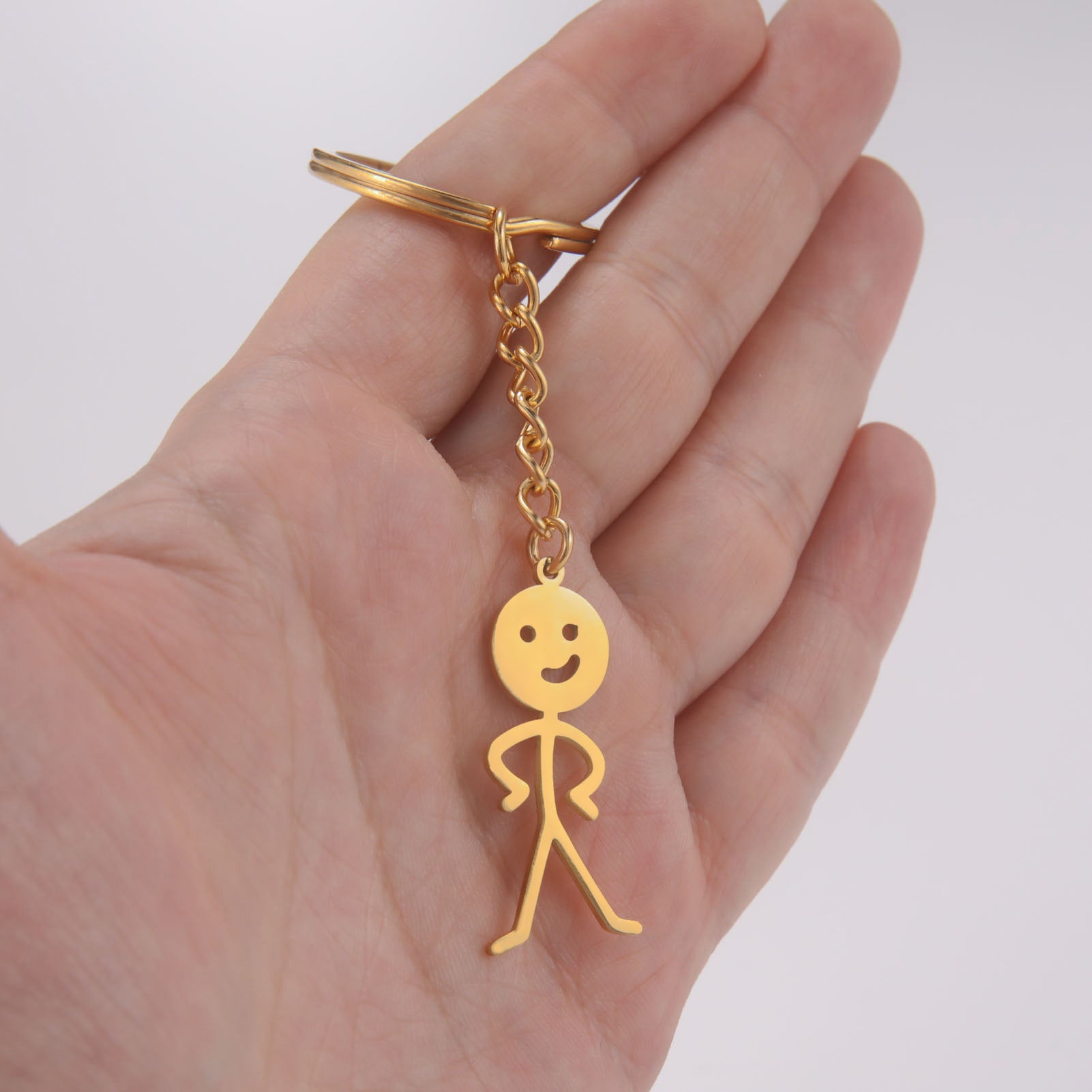 Wholesale Titanium Steel Cut Smooth Akimbo Figurine Keychain