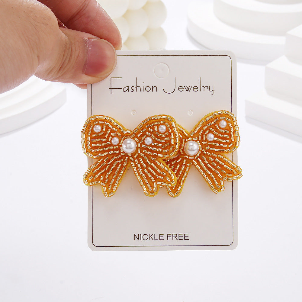 Wholesale Bohemian Holiday Style Bow Rice Beads Female Niche Versatile Simple Earrings