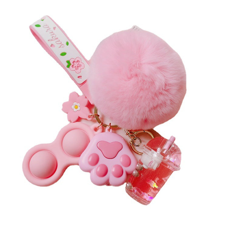 Silicona de silicona al por mayor Liquid Glow Cat Claw Fur Ball Keychain