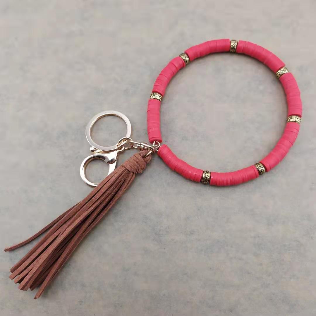 Llavero de muñeca de borla de arcilla colorida al por mayor