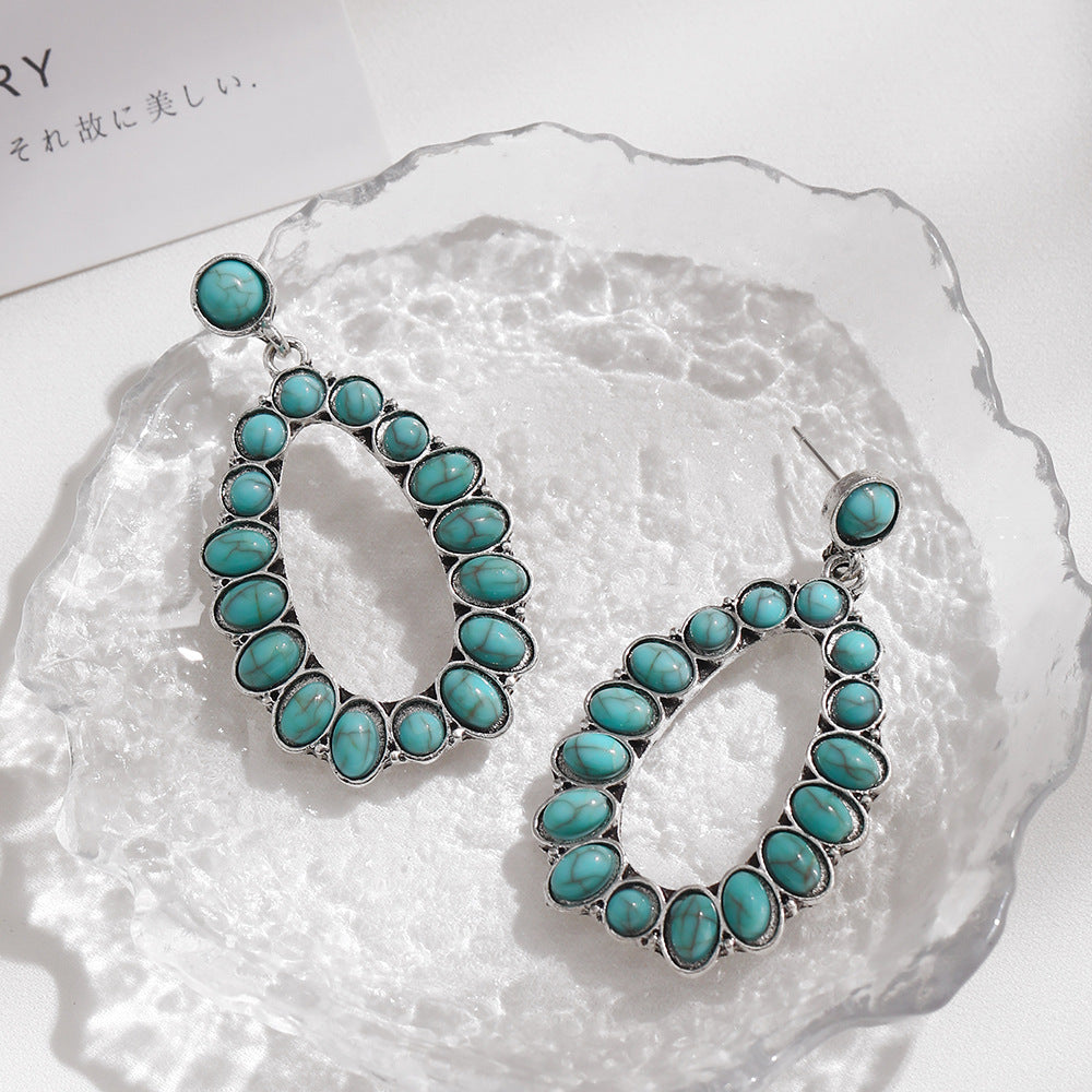 Wholesale Exaggerated retro oval turquoise teardrop-shaped hollow earrings
