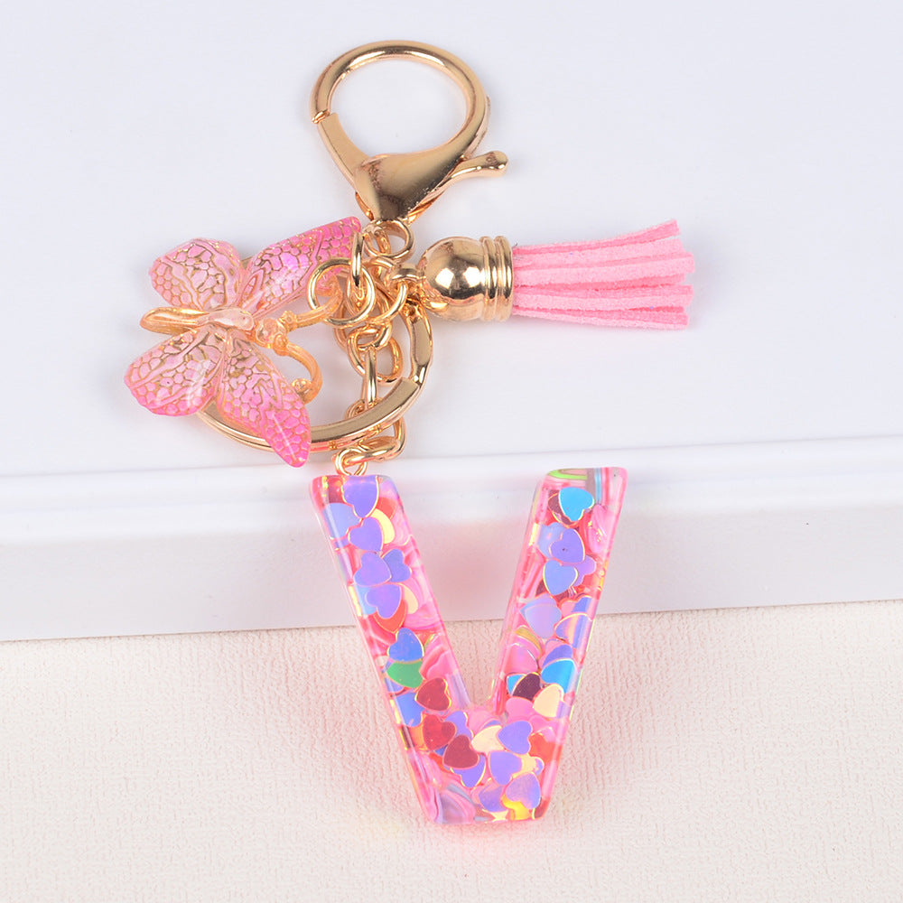 卸売ピンクタッセルバタフライグリッターレター樹脂キーホルダー