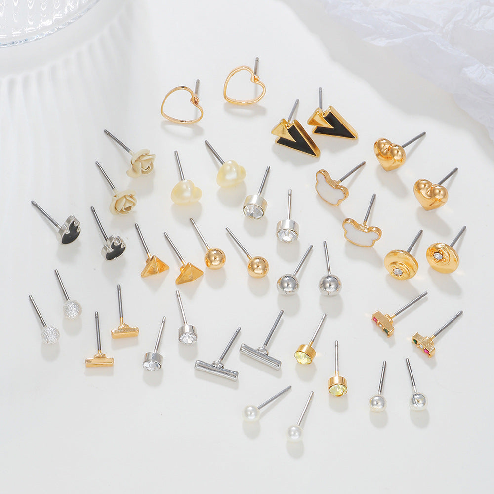 Pendientes de pernos pequeños de aleación al por mayor para pendientes de una semana