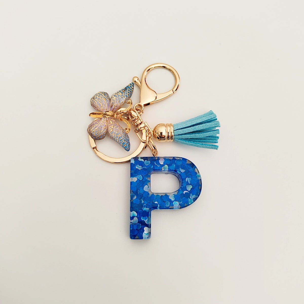 Wholesale blue crystal epoxy letter key chain pendant resin sequined butterfly key chain