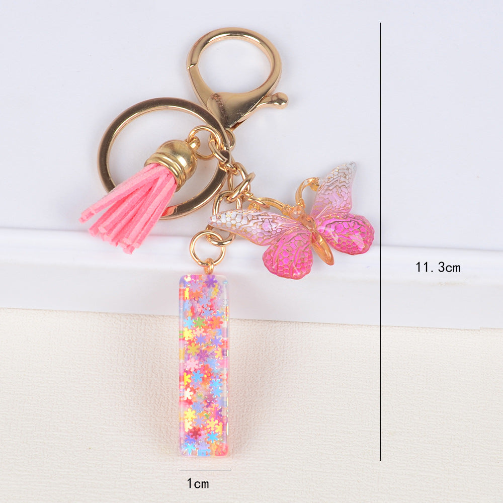 卸売スパンコールスノーフレークレター樹脂キーホルダー