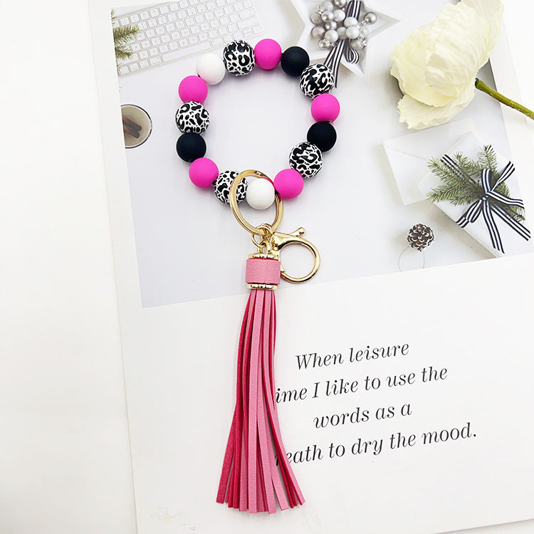 Wholesale Leopard Print White Bottom Wooden Beads Rubber Paint Round Beads PU Tassel Bracelet Keychain