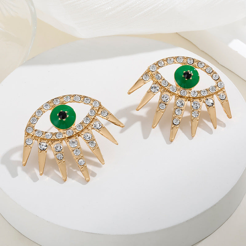 Wholesale Alloy Gold Plated Diamond Dripping Devil's Eye Earrings