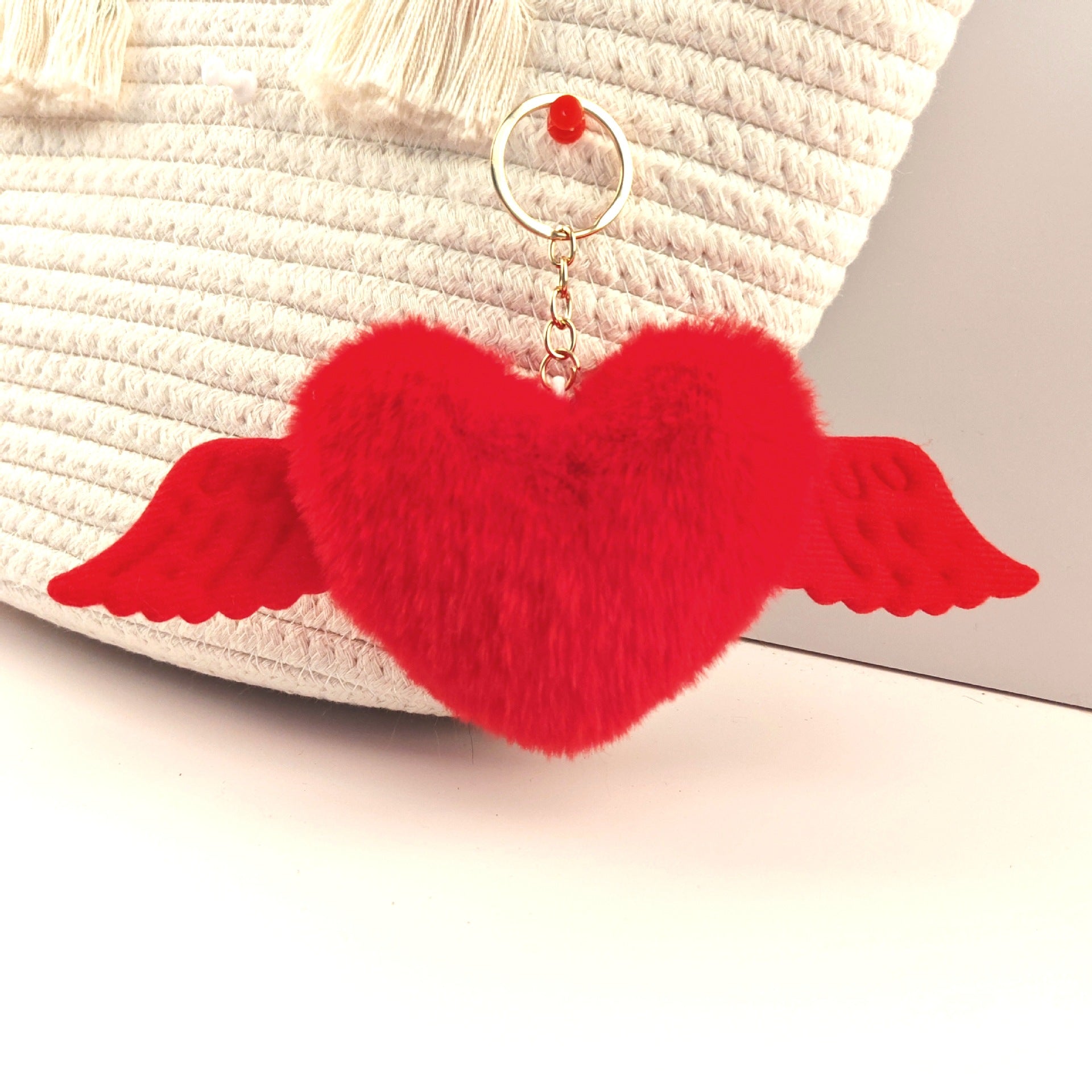 Wholesale Heart wings fur ball keychain