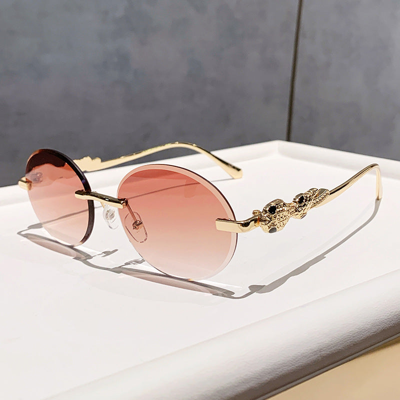Wholesale Retro oval frameless sunshade sunglasses