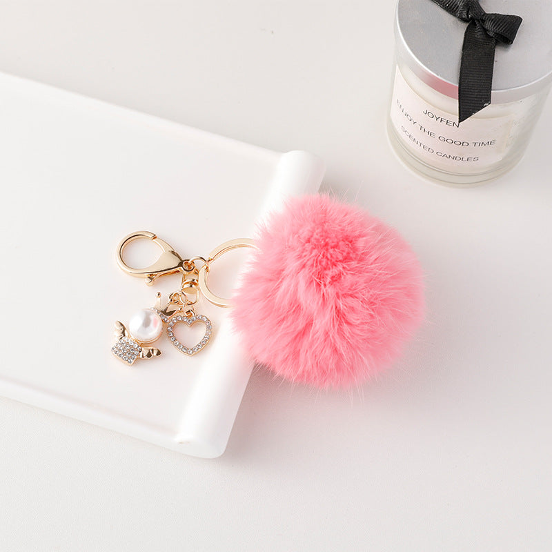 Wholesale of Cute Diamond Inlaid Angel Fur Ball Metal Keychains