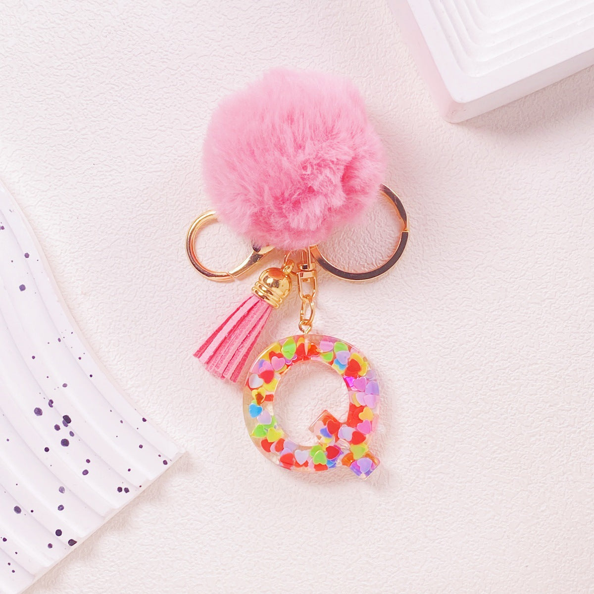 Wholesale Hairball English 26 letter pink Pom Pom keychain