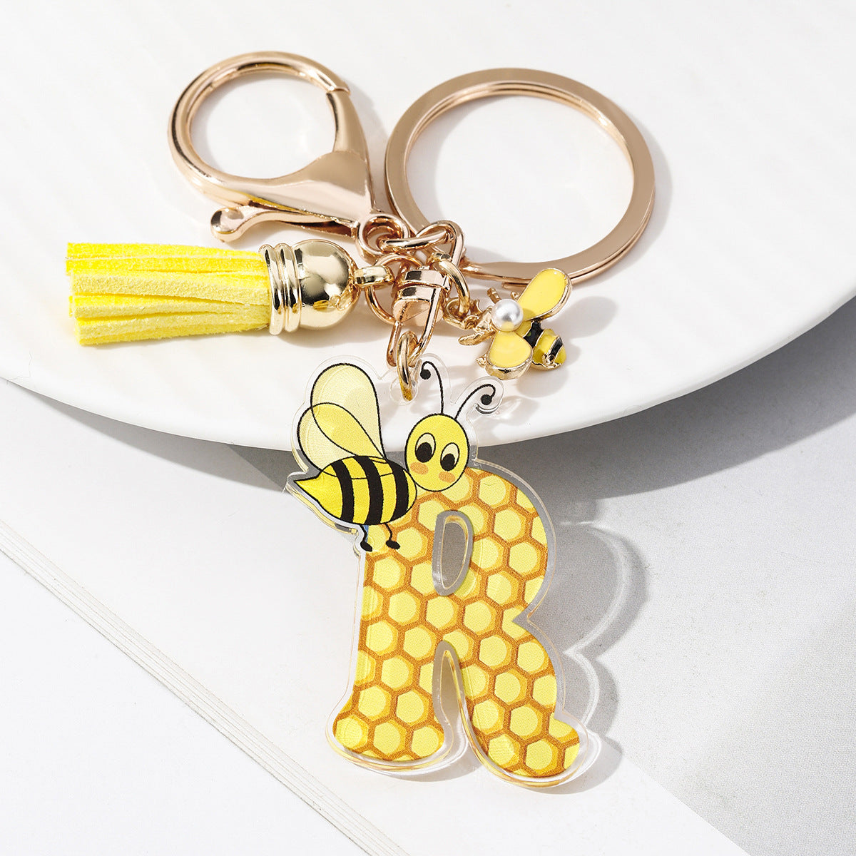 Wholesale Bee Honeycomb Acrylic English Letter Tassel Bee Enamel Keychain