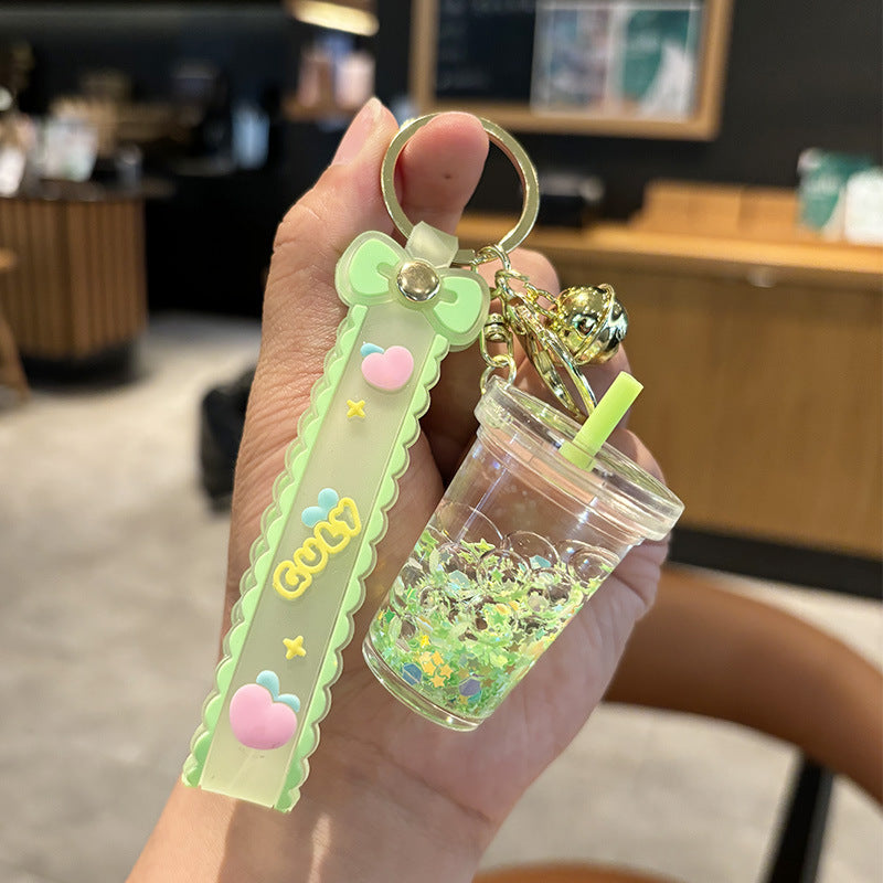 Wholesale quicksand luminous cup keychain liquid oil drift bottle pendant