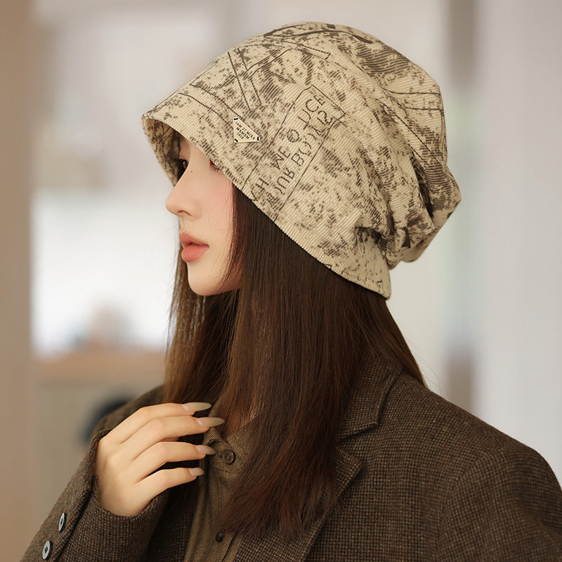 Wholesale New autumn and winter printed pile hats,  windproof and face-revealing small bun hats,  warm cold hats