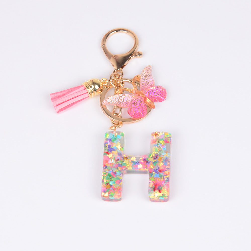 卸売スパンコール英語蝶タッセル文字樹脂キーホルダー