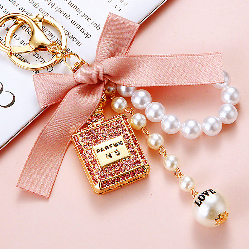 Wholesale Pearl Perfume Bottle Bow Rhinestone Keychain Bag Charm Chic Fashion Accessory Boutique Gift