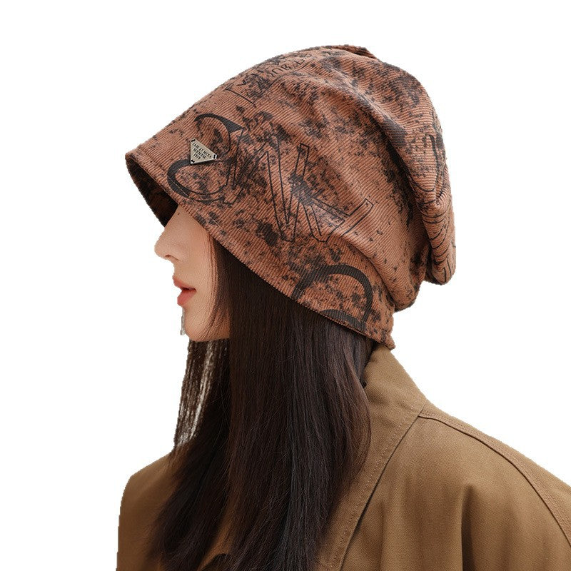 Wholesale New autumn and winter printed pile hats,  windproof and face-revealing small bun hats,  warm cold hats