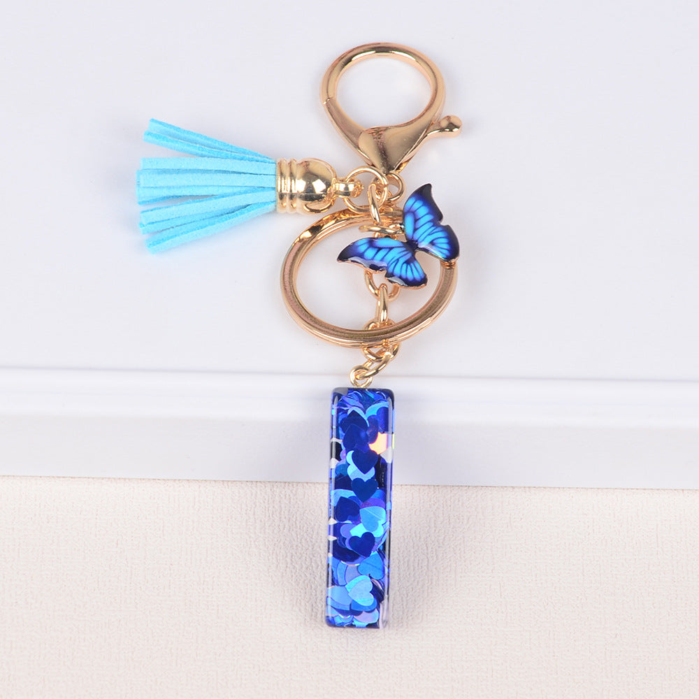 卸売ブルーラブバタフライタッセルレター樹脂キーホルダー
