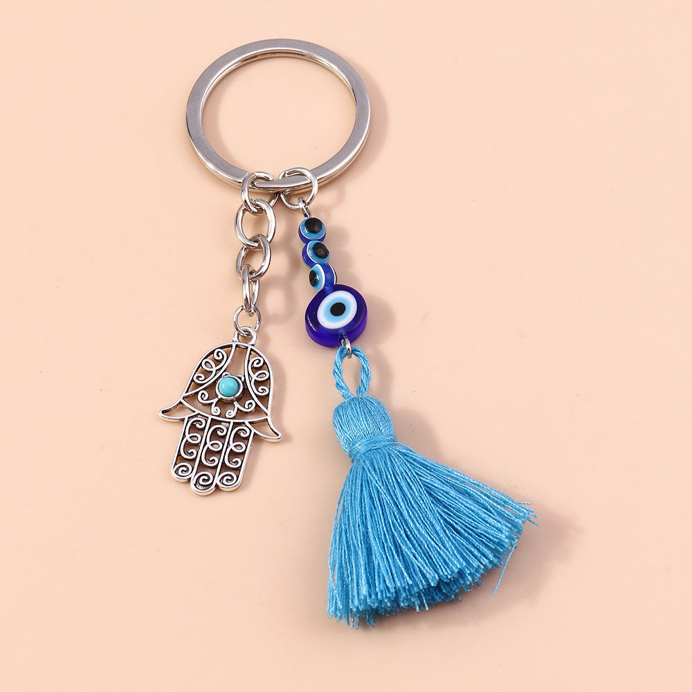 Wholesale Devil's Eye Hollow Palm Tassels Zinc Alloy Keychain