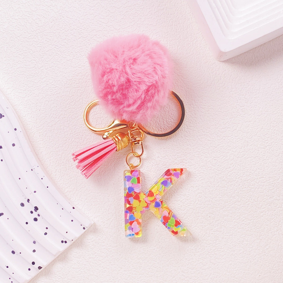 Wholesale Hairball English 26 letter pink Pom Pom keychain