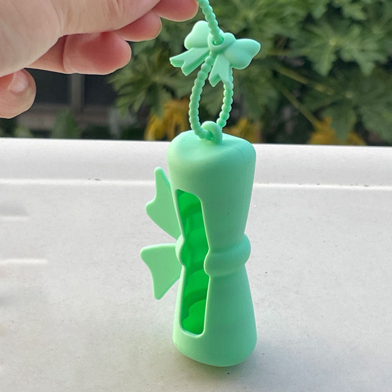 Wholesale Lipstick case silicone protective case bow lipstick bag keychain