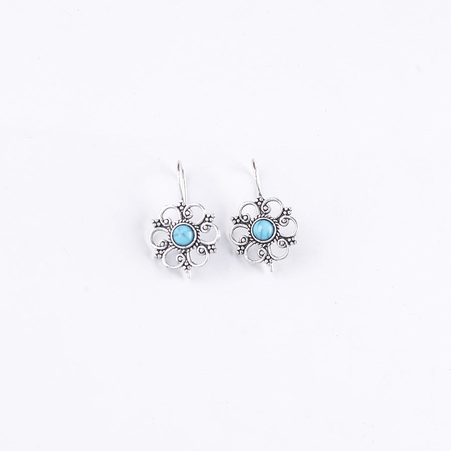 Wholesale Hollow petal inlaid turquoise drop earrings