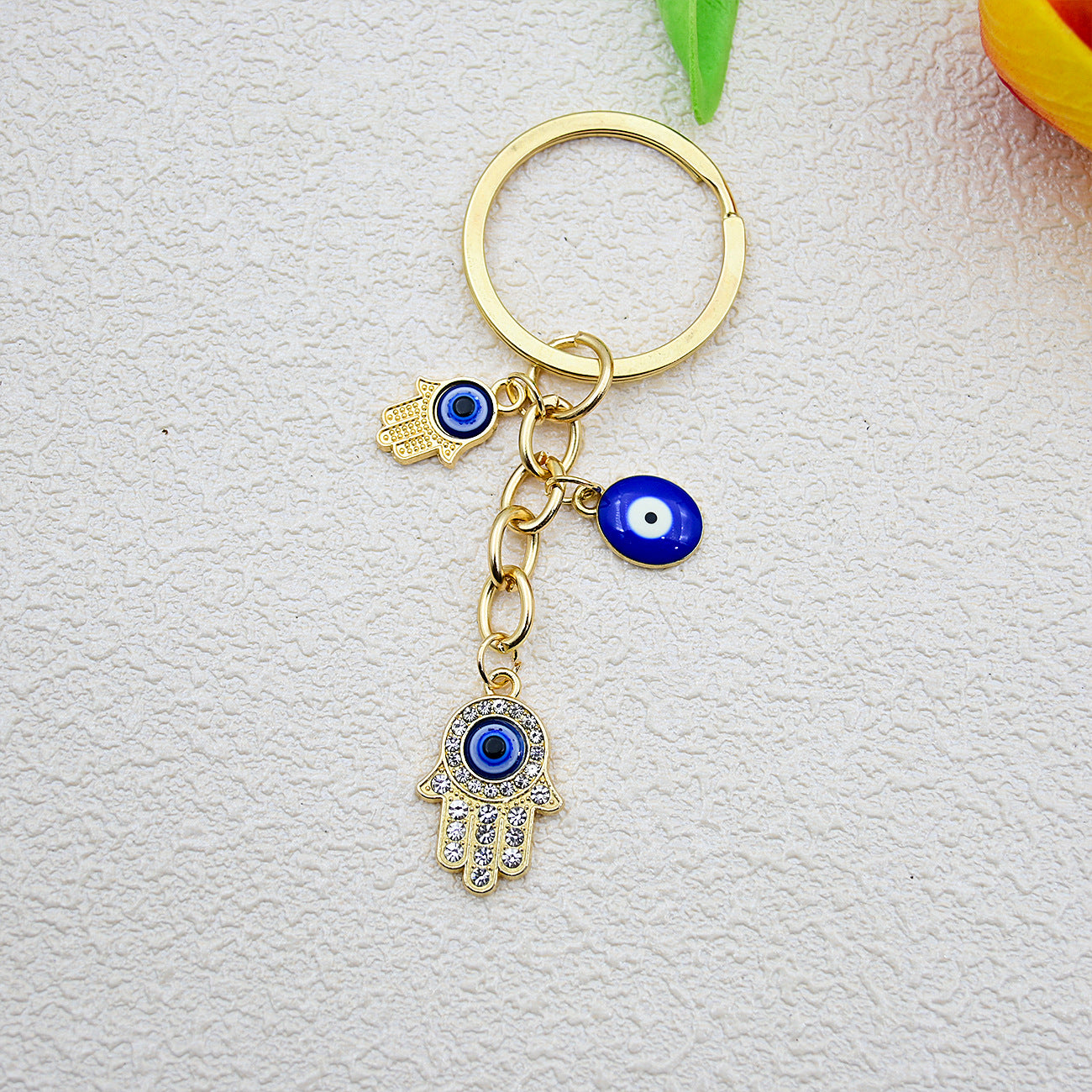 Wholesale Heart-shaped palm water droplet Devil' s eye keychain