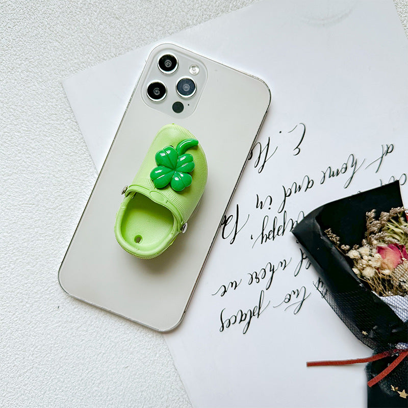 Zapatillas de cara sonrientes al por mayor soporte de airbag de teléfono móvil de plástico