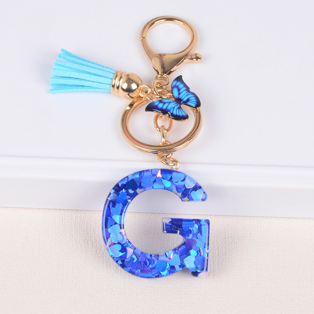 卸売ブルーラブバタフライタッセルレター樹脂キーホルダー