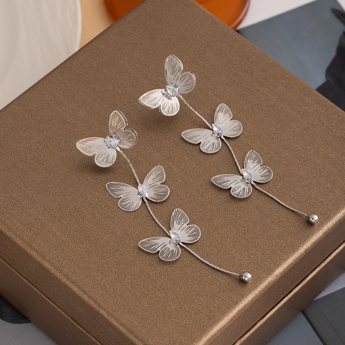 Wholesale Silver Needle Metal Style Three-Dimensional Bow Tassel Earrings