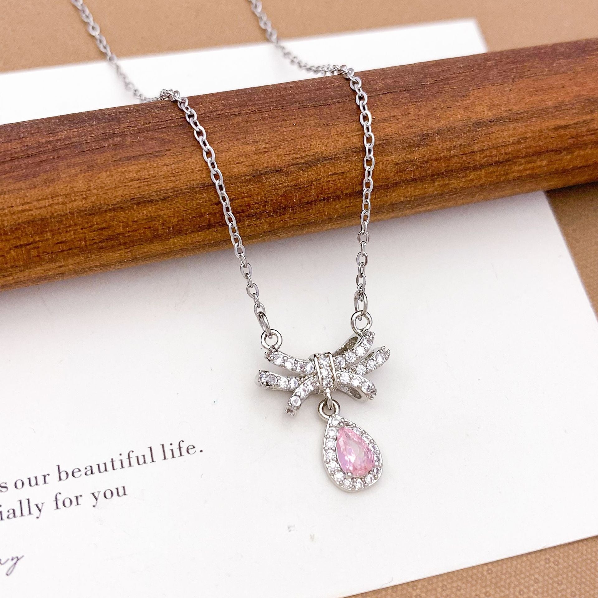 Wholesale Pink heart-shaped bow with diamond studded titanium steel necklace