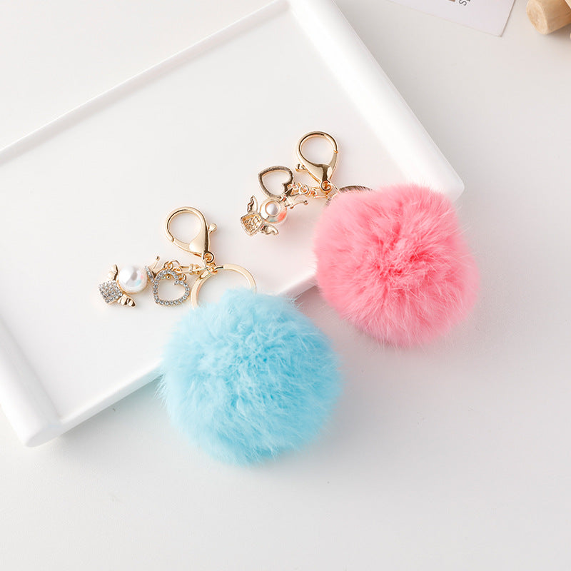 Wholesale of Cute Diamond Inlaid Angel Fur Ball Metal Keychains