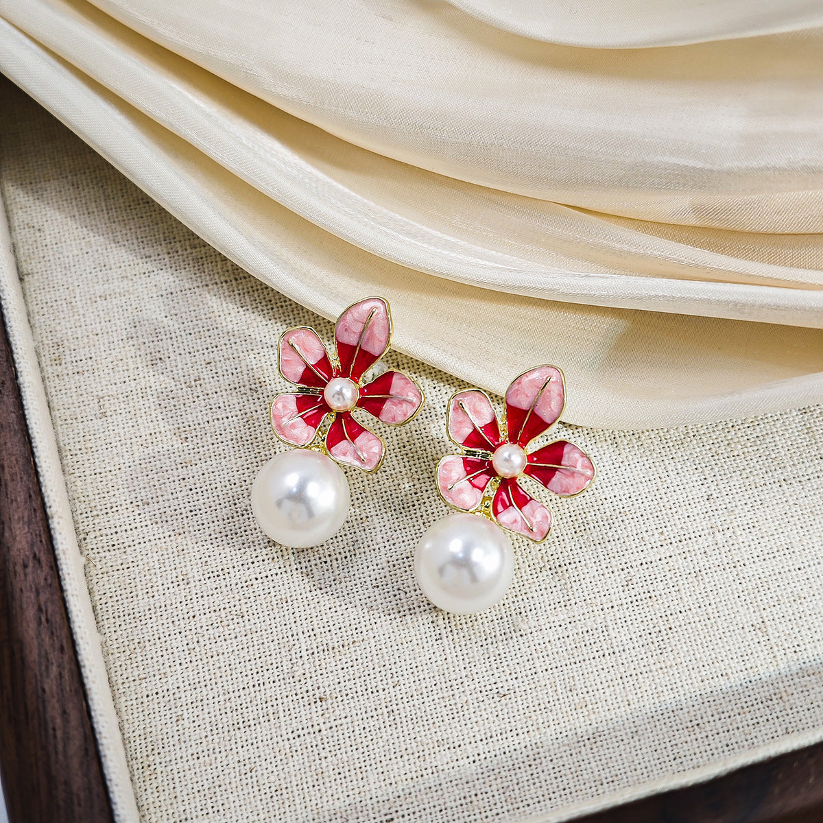 Wholesale Sweet oil-drop flower pearl earrings enamel powder blue petal earrings