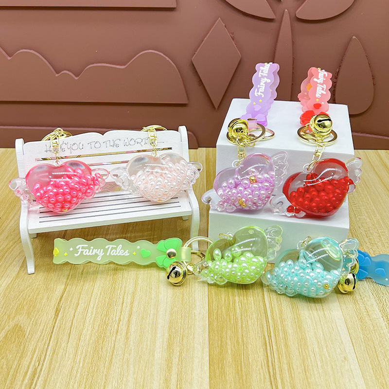 Wholesale Oil-infused Golden Bean Wing Heart Keychain