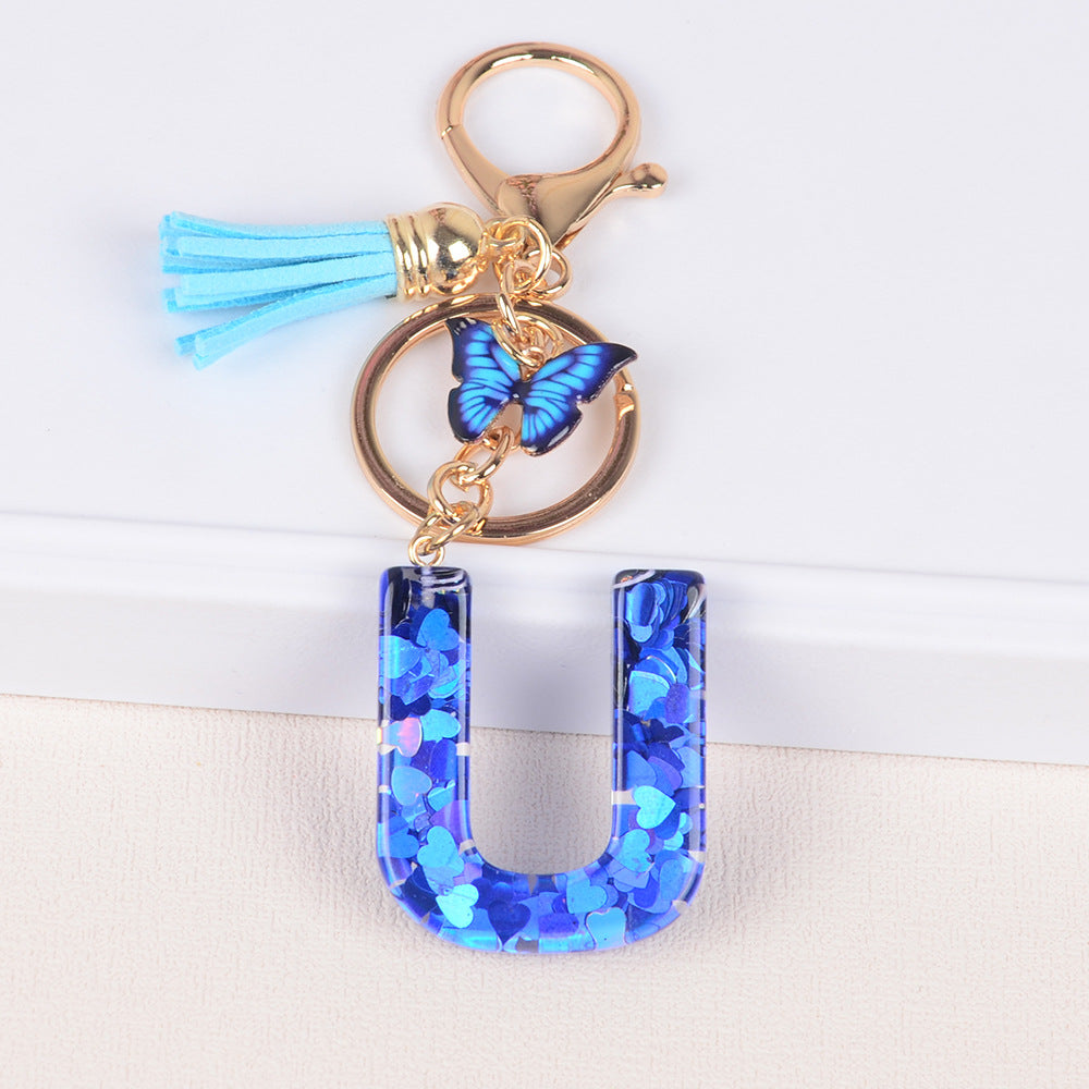 卸売ブルーラブバタフライタッセルレター樹脂キーホルダー