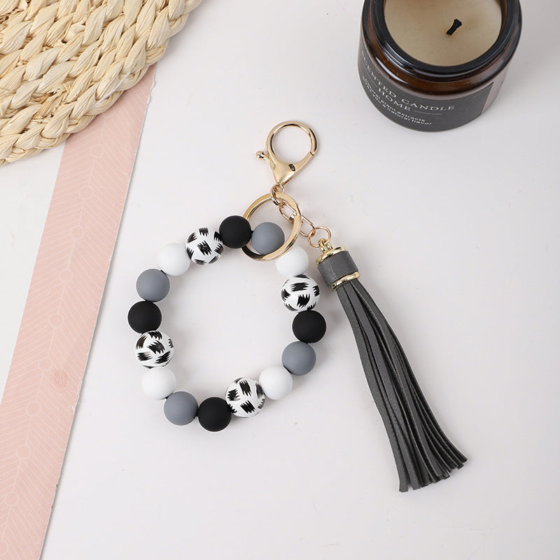 Llavero de muñeca de silicona de borla al por mayor