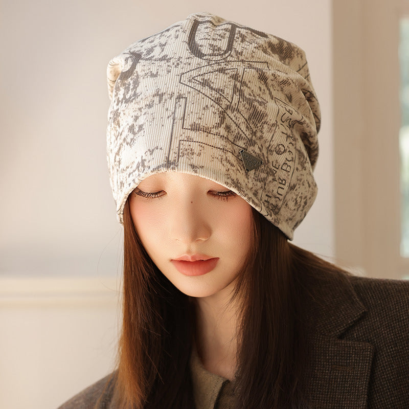 Wholesale New autumn and winter printed pile hats,  windproof and face-revealing small bun hats,  warm cold hats