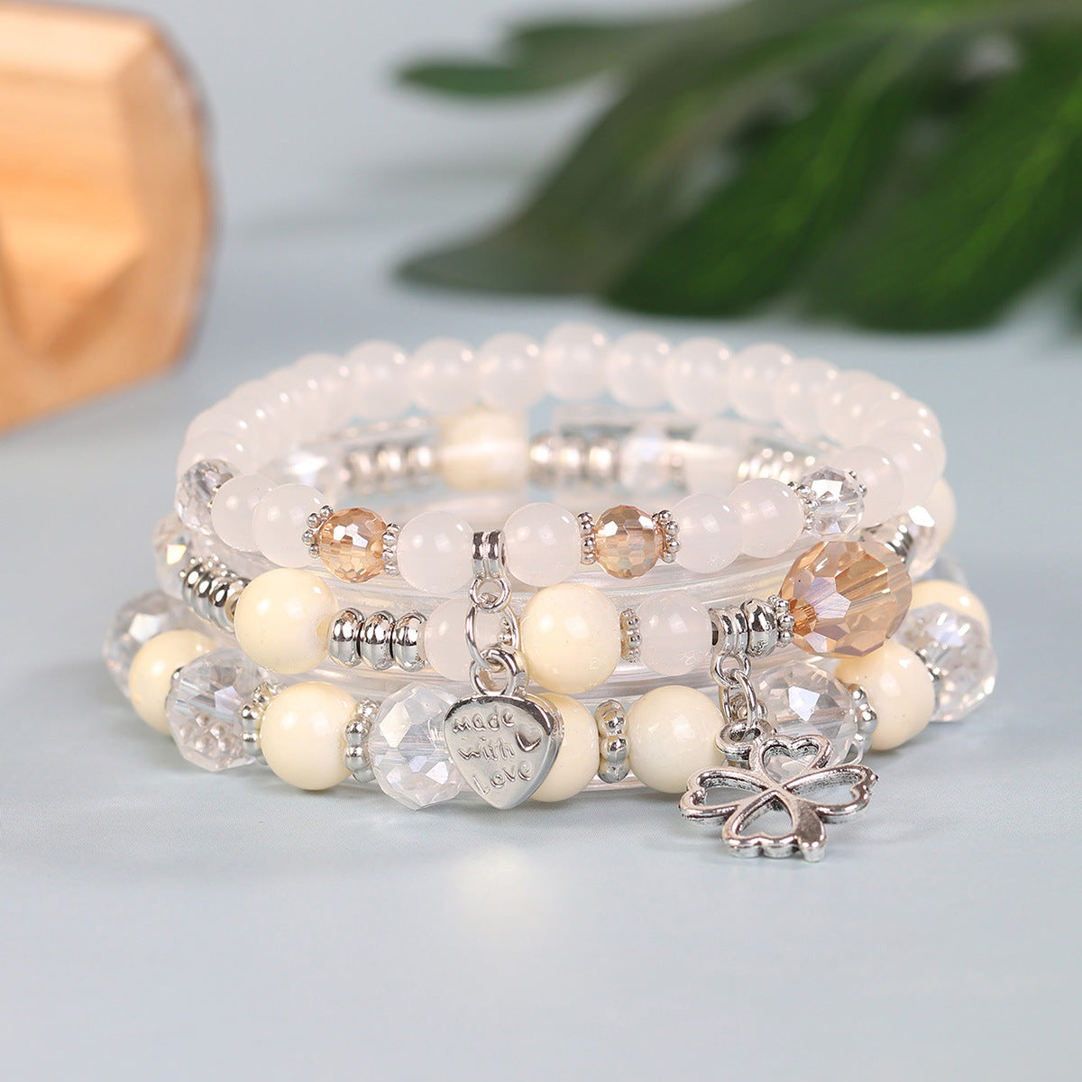 Wholesale Four Leaf Grass Heart Multi Layered Pendant Glass Elastic Bracelet