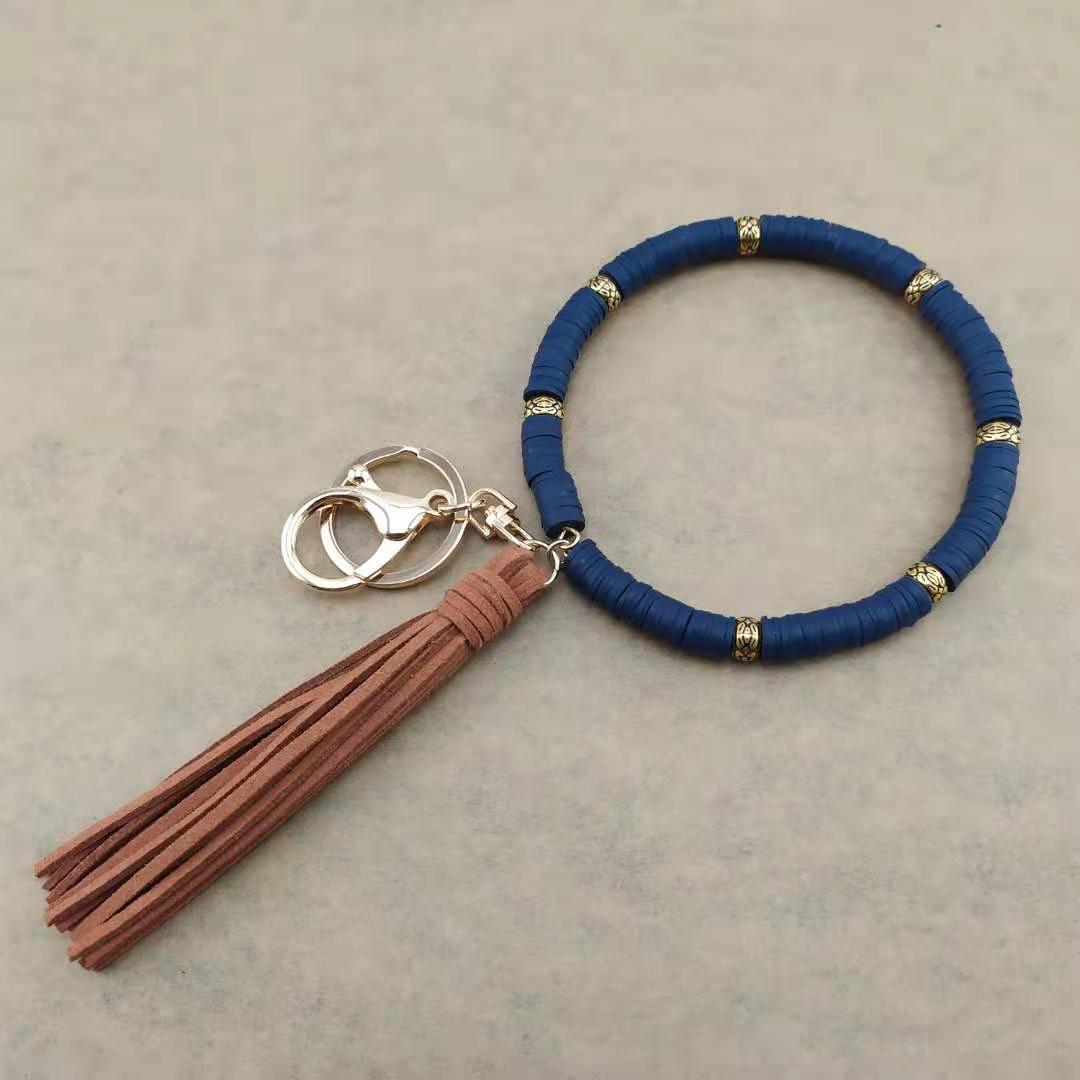 Llavero de muñeca de borla de arcilla colorida al por mayor