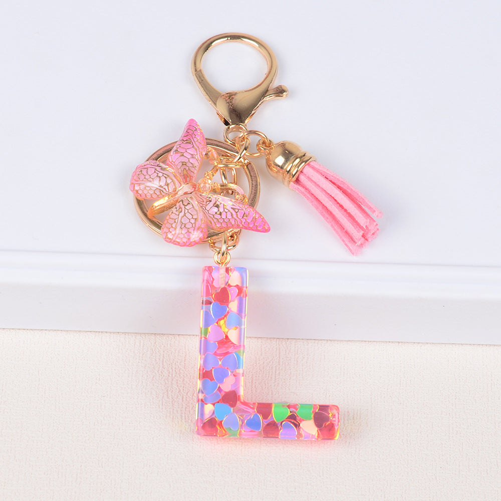 卸売ピンクタッセルバタフライグリッターレター樹脂キーホルダー